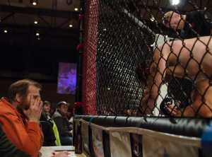 A scoring judge watches Nathan Hall as he gets into a position that helps him win against Randy Willard at Friday night's beatdown. The event was held at Centennial Hall. Nathan Hall won the match.