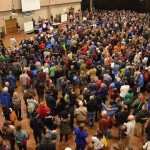 Voters fill Centennial Hall's Sheffield Ballroom during the Juneau Democratic Caucus on Saturday, March 26, 2016 as Rep. Sam Kito III, D-Juneau, speaks from the podium as the chairman of the event.
