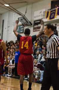 Kake's Kip Howard celebrates their victory over Huna for the Masters Bracket title during the 70th annual Gold Medal Basketball Tournament championship game Saturday at Juneau-Douglas High School. Kake won 70-64.
