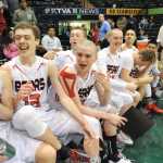Player of the Game Guy Bean, center, shares a laugh with fellow starters Treyson Ramos, far left, and Kaleb Tompkins, left, during their ASAA March Madness Alaska 4A championship win on Saturday in Anchorage.