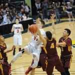 Juneau-Douglas High School's Kolby Hoover goes in for a layup.