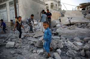 FILE -- In this Sept. 8, 2015 file photo, children play amid the rubble of a house destroyed by a Saudi-led airstrike in Sanaa, Yemen. Hunger has been the most horrific consequence of Yemen's conflict and has spiraled since Saudi Arabia and its allies, backed by the U.S., launched a campaign of airstrikes and a naval blockade a year ago. (AP Photo/Hani Mohammed, File)