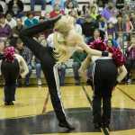 Ashley Wittwer, senior captain of the team, impresses with her flexibility in the pom routine.