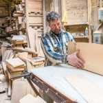 Brent Cole demonstrates soundboard production in his wood shop. Photo Bethany Goodrich, 2014.