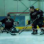 Ben Collman attempts to get a shot off against goalie Jeremy Lavender while Michael Sigler thwarts the effort. Jason Kohlhase looks on.