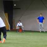 Thunder Mountain High School's Owen Swanton throws a pitch during baseball practice Tuesday at the Wells Fargo Dimond Park Fieldhouse.