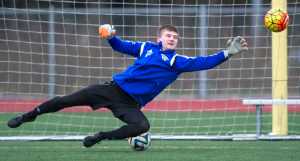 Senior goalie John Seymour dives for a ball during Thunder Mountain High School boys soccer team practice Wednesday at TMHS.
