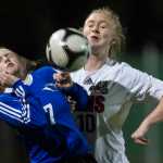 Thunder Mountain's Raye Coffee, left, and Juneau-Douglas' Erika Holst compete for the ball at Adair-Kennedy Memorial Park on Friday.
