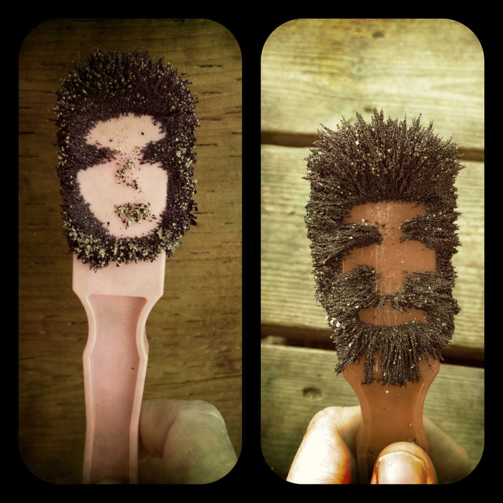 Two people created on magnet wands from the tonalite and magnetite black sand from Eagle Beach, which is highly magnetic. Photo by Amy Pinney.