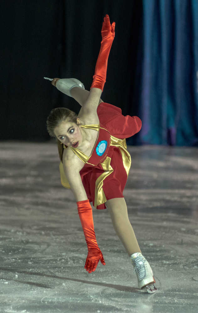 Kara Hort wears an Iron Man costume while performing during the Juneau Skating Club's "Heroes and Villains" show at Treadwell Arena on Saturday.