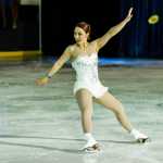 Guest performer and international competitor Courtney Hicks leans back on her blade edges while performing to the song Amazing Grace at a Juneau Skating Club performance at Treadwell Arena on Saturday.