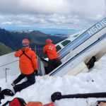 Members of Sitka Mountain Rescue inspect a Cessna 206 that crashed on the southern edge of Admiralty Island on Friday. Three people including the pilot were killed, and another passenger is in critical condition.