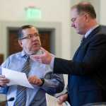 Sen. Lyman Hoffman, D-Bethel, left, asks a question of Legislative Finance Director David Teal after the introduction of a new Permanent Fund Dividend bill in the Senate Finance Committee Tuesday that aims to reduce Alaska's budget deficit.