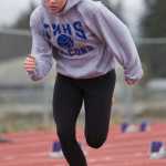 Junior Aly Heaton works off the blocks at Thunder Mountain High School track practice on Tuesday.