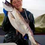 Ellie Schmidt, on the crew of FV I Gotta, appreciates a good salmon. Courtesy of Sophie Nethercut.