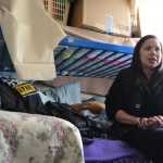 Bergmann Hotel resident Veronica Shortcakes sits on her bed while talking about life in the derelict building. She has lived there since mid December, which she says is "too long."