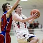 Juneau-Douglas' Guy Bean drives against Sitka's Trevan Coleman at JDHS on Thursday. JDHS won 71-60.