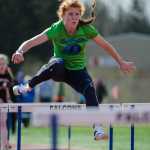 Naomi Welling leads in the 100M Hurdle during their meet against JDHS on Saturday at Thunder Mountain's field.