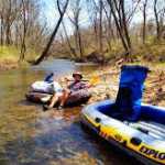 Lounging in a river raft.