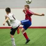 Juneau Soccer Club's Gavin Millard, right, competes for the ball against his Whitehorse Soccer Club opponent during a weekend exchange tournament April 15-17, 2016, at the Canada Games Centre in Whitehorse, Yukon.