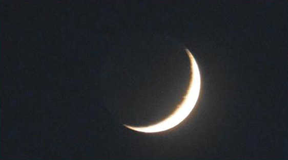 The crescent moon waxes on April 9. Photo by Denise Carroll.