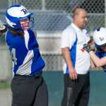 Thunder Mountain High School softball coach Jorge Cordero watches as seniors Makayla Harp, left, and Tracy Brurassa take batting practice at Dimond Park on Tuesday.