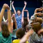 University of Alaska Southeast drama student Rochelle Smallwood gets students to participate in their production of "The Fisherman and his Wife" at Montessori Borealis School on Thursday, April 14.