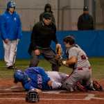 Juneau-Douglas High School catcher Alex Muir tags out Sitka's Kyle Fitzsimmons at Moller Field in Sitka on Friday.