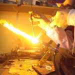 Photo by Kelly Sullivan/ Peninsula Clarion Jack Dean said when blowing into a glass piece it is essential to hold the surface directly in the flame, otherwise the formation may explode sending hundreds of tiny glass shards into the air Monday, April 11, 2016, in Kenai, Alaska.