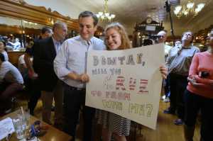 Republican presidential candidate Sen. Ted Cruz, R-Texas, poses for a photo with a supporter who asked him to her school's prom during a campaign stop at Zaharakos Ice Cream Parlor in Columbus, Ind., Monday, April 25, 2016. (AP Photo/Michael Conroy)