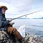 Peter Edillor fishes off the rocks at False Outer Point for king salmon on Monday. The 20th Annual Spring King Salmon Derby starts on Sunday, May 1, and runs through the month of May.