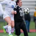 Thunder Mountain's Anne Coogan, left, battles Juneau-Douglas' Amber White for the ball during their game at Thunder Mountain HIgh School on Tuesday. JDHS won 5-0.
