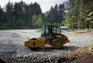 A foundation is compacted for an area to hold new tennis courts in Cope Park on Wednesday. The park is closed while the area is being remodeled with play equipment and a new picnic area. A new water main running through the park is also being installed.