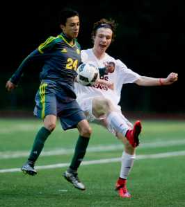 Juneau-Douglas' Corbin Mitchell, right, battles with Service 's Tyler Montano during their game at Adair Kennedy Memorial Park on Friday.