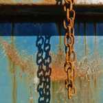 A rusty dumpster chain at Eagle Valley Center. Photo by Brooke Daly