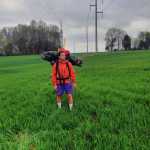 Logan Miller standing outside.