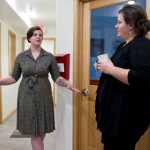 Meryl Chew, AWARE, Inc. Shelter Advocate, left, speaks with Mandy Cole, direct services manager for AWARE, at the women's shelter's new transitional housing in Juneau on Wednesday. The new 12-unit building will provide transitional housing and programs to allow women to gain their footing after an abusive relationship in a way the emergency shelter cannot.