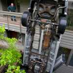 Tony Baxter, a resident of the Westridge Condominiums, looks at a truck standing on end outside his apartment on Friday. The driver was unhurt in the accident that happened about noon on Friday. The driver, who did not wish to be identified, said his brakes did not work.