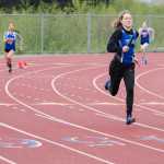 Thunder Mountain's Ava Tompkins lead in the first lap of the 800-meter 4x2 relay during the track meet Saturday morning at the Thunder Mountain.