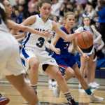 In this January 2016 photo, Thunder Mountain's Ava Tompkins drives against Sitka's Alex Kirby, left, and Hailey Denkinger during a game at TMHS. Tompkins has signed to play college basketball at Wesleyan University in Connecticut.