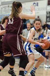 In this February 2016 photo, Thunder Mountain's Ava Tompkins looks to drive against Ketchikans' Courtney Kemble, front, and Alexis Biggerstaff, back, during a game at TMHS. Tompkins has signed to play college basketball at Wesleyan University in Connecticut.