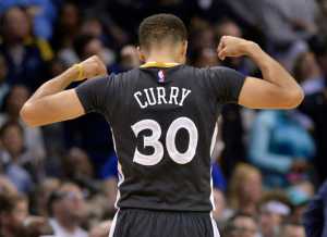 FILE - In this April 9, 2016, file photo, Golden State Warriors guard Stephen Curry reacts in the second half of an NBA basketball game against the Memphis Grizzlies in Memphis, Tenn.  Curry is adding a second straight MVP award to his record-setting season, a person with knowledge of the award told The Associated Press, Monday, May 9, 2016. The person spoke on condition of anonymity because the NBA has not revealed the winner. (AP Photo/Brandon Dill, File)