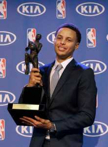 Golden State Warriors guard Stephen Curry holds the NBA's Most Valuable Player award  on May 4 in Oakland, California. Curry carried the top-seeded Warriors to a franchise-record 67 wins and surpassed his own record for most 3-pointers in a season.