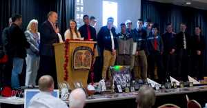 Gov. Bill Walker and members of the Juneau legislative delegation, Sen. Dennis Egan, Rep. Sam Kito III and Rep. Cathy Muñoz, congratulate the Juneau-Douglas High School boys basketball team for winning the state championship during an award banquet at the Elizabeth Peratrovich Hall Tuesday evening.