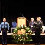 Alaska State Trooper Justin Hilario, left, visiting from Dillingham, stands with Juneau Police Department Lt. Kris Sell, right, Friday at Centennial Hall after the pair carried a wreath in honor of fallen officers during the Alaska Peace Officers Association police memorial.