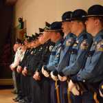 Alaska State Troopers and Juneau Police Department officers stand in a line during the Alaska Peace Officers Association police memorial Friday at Centennial Hall to remember those lost on duty. Since 1908, 48 officers in Alaska have lost their lives on the job.