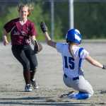 Thunder Mountain's Haleigh Dicarlo slides safely into second base as Ketchikan's Kayla Schaffer watches an errant throw go by at Dimond Park on Friday.