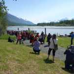 The Jilkaat Kwaan Heritage Dancers lead a procession along the river path from fish camp to the new heritage center on Saturday, May 14.