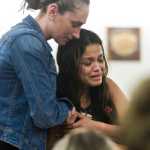 Maria Rosales, whose husband Duilio Antonio "Tony" Rosales, 34, was fatally shot Sunday night at a remote Excursion Inlet cabin, cries as she is escorted out of Juneau District Court Tuesday by Mattie Rielly-Bixby, a paralegal for the Juneau District Attorney's Office. Mark De Simone was charged with first- and second-degree murder in connection to Rosales' death and is behind held in custody in lieu of $500,000 bail.