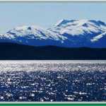 Sunlight dancing on the water in front of the Shrine with the Chilkats in the background.